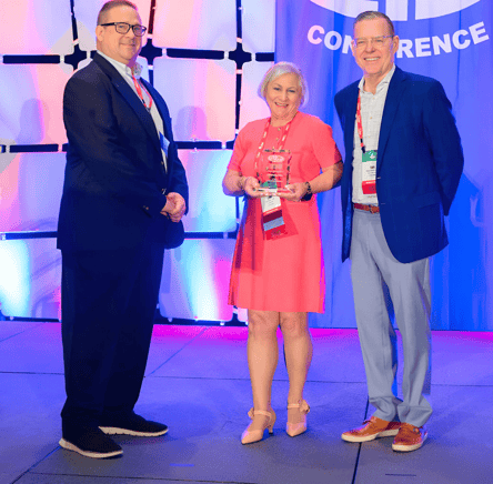 Lori Bruno, CPMR, accepts the Tess Hill Award.-2